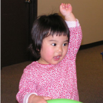 Little girl with raised hand