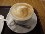 Photo of coffee cup with foamy latte
