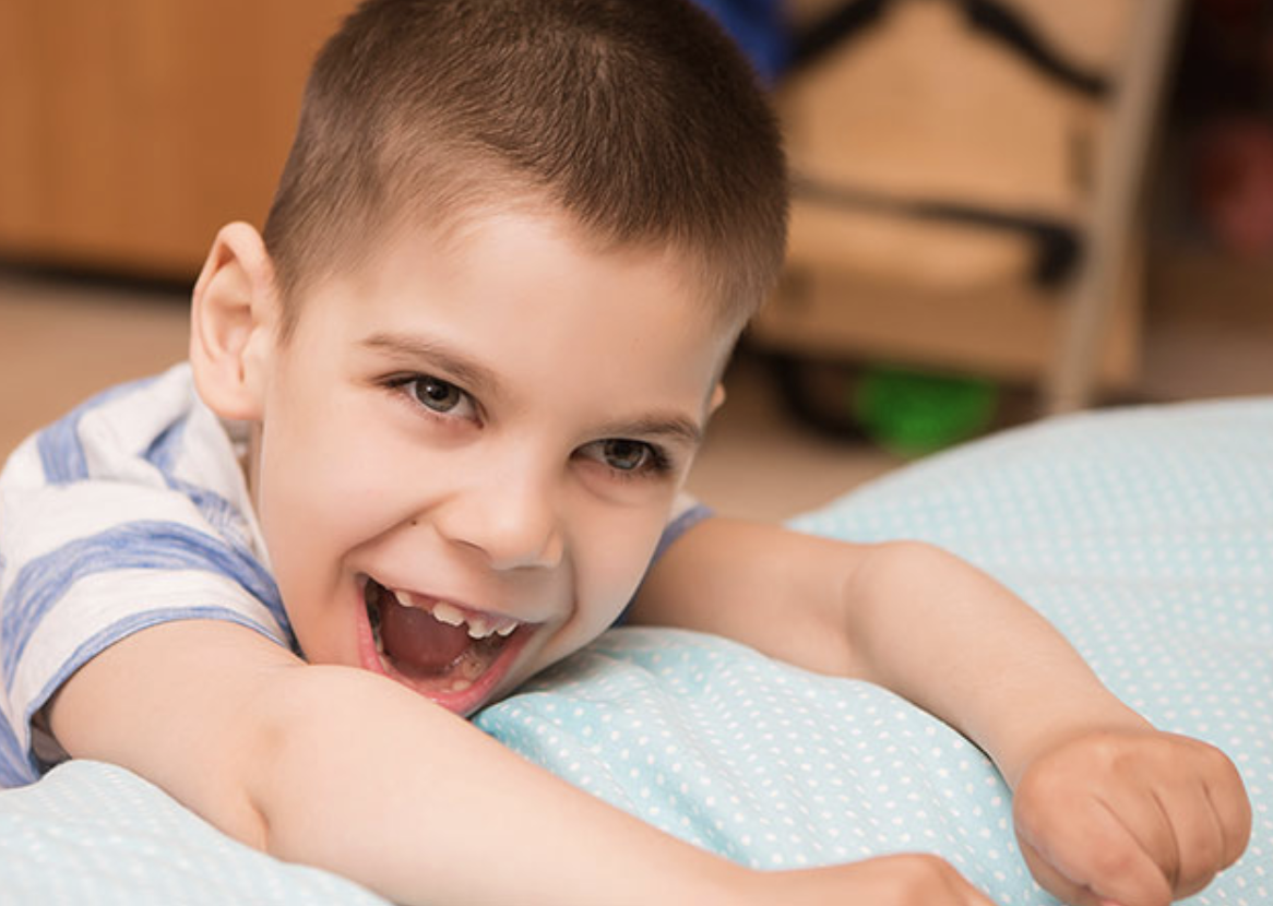 Photo: young child laughing